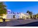 Contemporary home showcasing a desert landscaped yard, clean lines, and an eye-catching white facade at 8525 W Verde Way, Las Vegas, NV 89149
