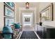 Elegant foyer with stylish decor and a view leading to the outdoor pool area at 8525 W Verde Way, Las Vegas, NV 89149