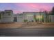Beautifully landscaped modern home with a welcoming exterior at twilight at 8525 W Verde Way, Las Vegas, NV 89149