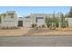 Modern home with desert landscaping, showcasing architectural style and curb appeal at 8525 W Verde Way, Las Vegas, NV 89149