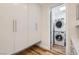 Spacious laundry room with storage and convenient, stacked washer and dryer at 8525 W Verde Way, Las Vegas, NV 89149