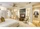 Comfortable main bedroom features a fireplace, hardwood floors, and neutral decor at 8525 W Verde Way, Las Vegas, NV 89149