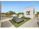 Rooftop lounge area with artificial turf and sleek daybeds, perfect for relaxing and enjoying the view at 8525 W Verde Way, Las Vegas, NV 89149