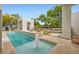 Inviting pool area with a cabana and water features, perfect for relaxation and entertainment at 8525 W Verde Way, Las Vegas, NV 89149