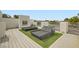Inviting rooftop patio with daybeds and outdoor fireplace, offering a cozy retreat with privacy at 8525 W Verde Way, Las Vegas, NV 89149