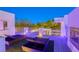 Inviting rooftop patio featuring an outdoor fireplace, lounge chairs, and scenic views at 8525 W Verde Way, Las Vegas, NV 89149