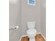 Powder room with modern white toilet and light wood flooring at 9024 Hazy Haven Ct, Las Vegas, NV 89149