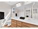 Bright bathroom features a double sink vanity, wood cabinets, and a large mirror at 9024 Hazy Haven Ct, Las Vegas, NV 89149