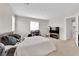 Spacious bedroom with carpeted floors, neutral paint, and a desk and TV area at 9024 Hazy Haven Ct, Las Vegas, NV 89149