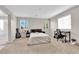 Bright main bedroom featuring neutral walls, carpet and a view into the main bathroom at 9024 Hazy Haven Ct, Las Vegas, NV 89149