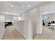Bright hallway with neutral tones, carpet, and open view to a bedroom with a window at 9024 Hazy Haven Ct, Las Vegas, NV 89149