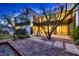 Modern backyard design featuring stone landscaping, patio and lush green shrubbery at 917 Vegas View Dr, Henderson, NV 89052