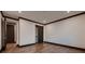 Bright bedroom with hardwood floors, dark trim and adjacent closet at 917 Vegas View Dr, Henderson, NV 89052