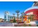 A mix of colors makes this building exterior stand out with manicured landscaping and bench seating at 917 Vegas View Dr, Henderson, NV 89052