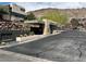 Welcoming guard house entrance with modern architecture and lush desert landscaping at 917 Vegas View Dr, Henderson, NV 89052