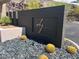 Stylish community sign with desert landscaping, rock features, and modern design elements at 917 Vegas View Dr, Henderson, NV 89052