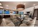 Bright dining area with a modern light fixture, next to the kitchen and living room at 917 Vegas View Dr, Henderson, NV 89052