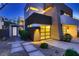 Modern home displaying a well-lit entry, contemporary design and low maintenance landscaping at 917 Vegas View Dr, Henderson, NV 89052