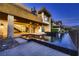 Luxurious home exterior showcases a striking architectural design, pool, and covered patio at 917 Vegas View Dr, Henderson, NV 89052