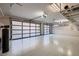 Spacious three car garage features an epoxy floor, storage racks and modern doors at 917 Vegas View Dr, Henderson, NV 89052