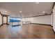 Spacious hallway with hardwood floors, modern railing, and large windows offering natural light and views at 917 Vegas View Dr, Henderson, NV 89052