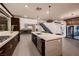 Spacious kitchen featuring a large island, modern appliances, and access to the backyard at 917 Vegas View Dr, Henderson, NV 89052