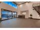 Bright living room with fireplace, high ceilings, and an indoor/outdoor flow to the pool at 917 Vegas View Dr, Henderson, NV 89052