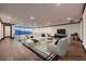 Virtually staged living room featuring hardwood floors, recessed lighting, and modern furniture for a cozy ambiance at 917 Vegas View Dr, Henderson, NV 89052