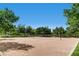 An open-air volleyball court surrounded by mature trees under a bright blue sky at 917 Vegas View Dr, Henderson, NV 89052