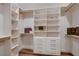 Bright walk-in closet featuring custom shelving, drawers, and hanging rods for optimal organization and storage at 917 Vegas View Dr, Henderson, NV 89052