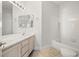 Bright bathroom features double sink vanity with brushed-gold hardware at 9491 Gainey Ranch Ave, Las Vegas, NV 89147