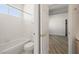 Bright bathroom features a bathtub with white tile surround, and white toilet at 9491 Gainey Ranch Ave, Las Vegas, NV 89147