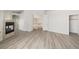 Spacious bedroom features wood-style flooring, stone-clad fireplace and closet at 9491 Gainey Ranch Ave, Las Vegas, NV 89147