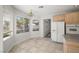 Charming breakfast nook filled with natural light from large windows with backyard views at 9491 Gainey Ranch Ave, Las Vegas, NV 89147