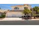 Charming two-story home featuring a tile roof, three-car garage, and well-maintained landscaping at 9491 Gainey Ranch Ave, Las Vegas, NV 89147