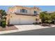 Charming home with tile roof, three-car garage, desert landscaping, and well-maintained exterior at 9491 Gainey Ranch Ave, Las Vegas, NV 89147