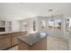 Open floorplan showing kitchen island, breakfast nook with backyard view and fireplace at 9491 Gainey Ranch Ave, Las Vegas, NV 89147