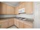 Updated kitchen featuring granite countertops, white appliances and gas cooktop at 9491 Gainey Ranch Ave, Las Vegas, NV 89147