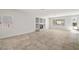 Spacious living room features tile floors, recessed lighting, built-in shelving and natural light at 9491 Gainey Ranch Ave, Las Vegas, NV 89147