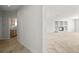 Open floor plan features neutral-toned tile flooring, a cozy fireplace and an open view of the kitchen at 9491 Gainey Ranch Ave, Las Vegas, NV 89147