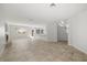 Inviting living area with tile flooring, fireplace, staircase and ample natural light at 9491 Gainey Ranch Ave, Las Vegas, NV 89147