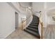 Beautiful curved staircase leading to the upper level of the home at 9491 Gainey Ranch Ave, Las Vegas, NV 89147