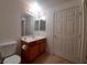 The bathroom has a single sink vanity and a well-lit mirror, blending style with utility at 9580 W Reno Ave # 183, Las Vegas, NV 89148