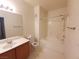 Well-lit bathroom featuring a combined shower and tub, alongside a toilet and vanity with ample storage at 9580 W Reno Ave # 183, Las Vegas, NV 89148