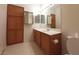 Bathroom features a spacious vanity with ample storage, a large mirror, and a toilet for convenience at 9580 W Reno Ave # 183, Las Vegas, NV 89148