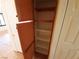 Functional wood cabinet with multiple shelves provides ample storage space inside the home at 9580 W Reno Ave # 183, Las Vegas, NV 89148