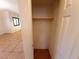 A simple closet features a top shelf and a rod for hanging clothes, maximizing storage space at 9580 W Reno Ave # 183, Las Vegas, NV 89148