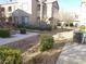 Condominium complex showcases tidy landscaping, exterior staircases, and a well-maintained community setting at 9580 W Reno Ave # 183, Las Vegas, NV 89148