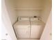 Bright laundry room features white washer and dryer and ample storage space, making chores a breeze at 9580 W Reno Ave # 183, Las Vegas, NV 89148