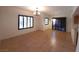 The bright living room features tile flooring, large windows with blinds, and an open layout at 9580 W Reno Ave # 183, Las Vegas, NV 89148